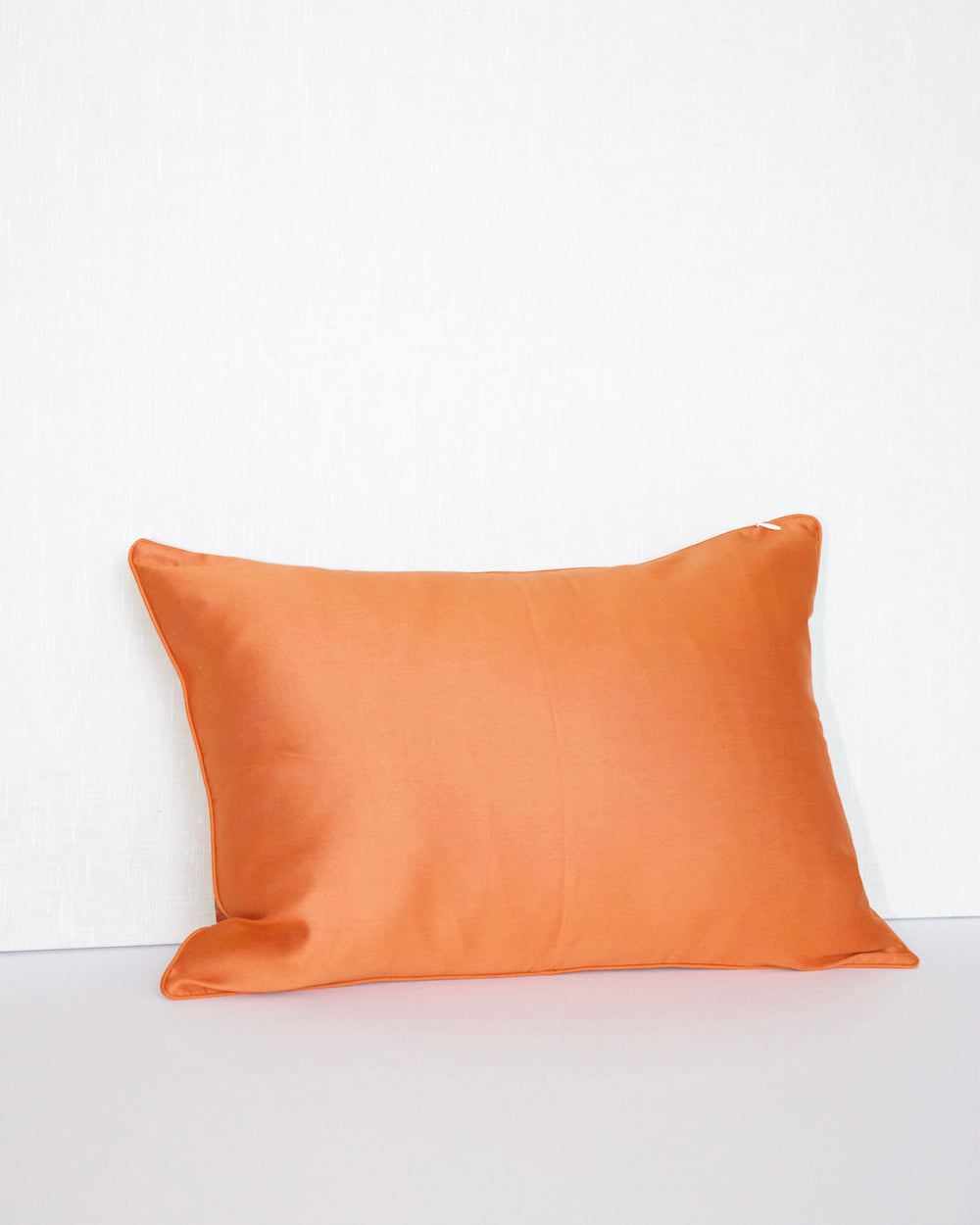 Handwoven 12x20 pillow cover made from luxurious Indian silk brocade, showcasing intricate gold, orange, and pink floral and geometric patterns. A stunning accent piece for any elegant decor.