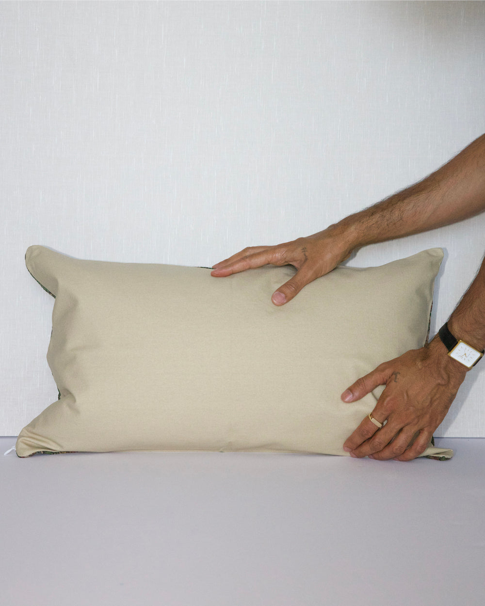 Handcrafted vintage Kantha pillow featuring a green floral block print design, adding bohemian and rustic charm to any room. The rectangular cushion is made from repurposed fabrics, reflecting traditional Indian craftsmanship