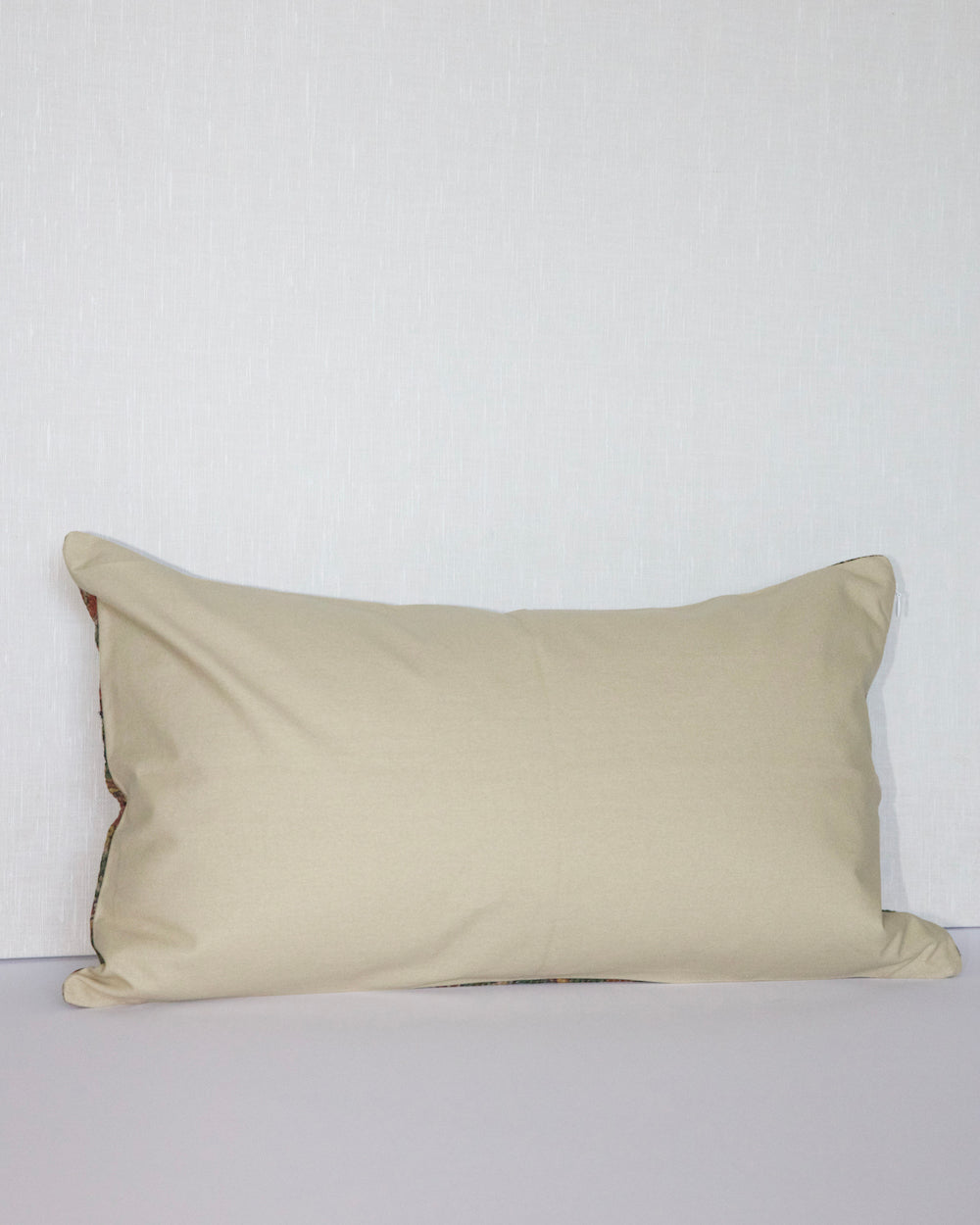 Handcrafted vintage Kantha pillow featuring a green floral block print design, adding bohemian and rustic charm to any room. The rectangular cushion is made from repurposed fabrics, reflecting traditional Indian craftsmanship