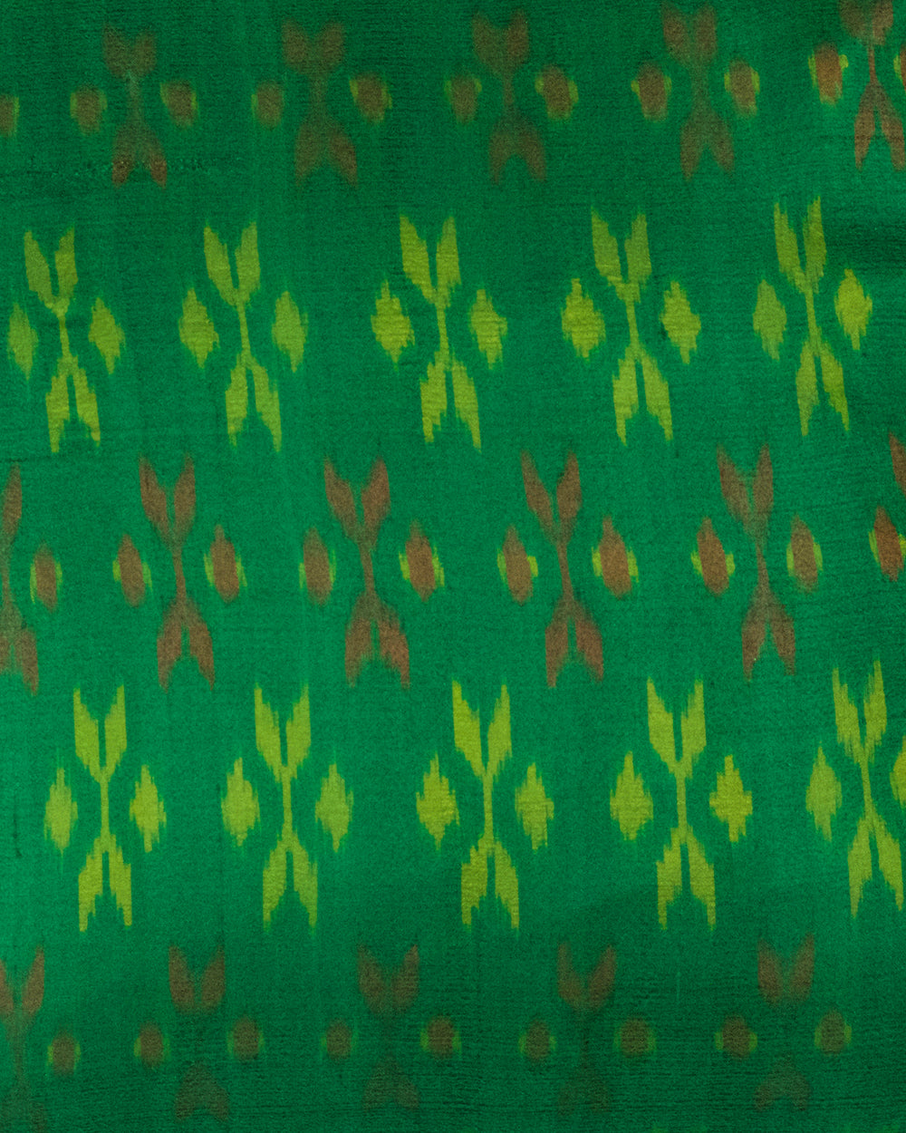 A handcrafted 20x20 pillow cover made from vibrant green silk with traditional ikat-inspired patterns in yellow and rust. The cushion’s border features an intricate design, adding a touch of artisanal craftsmanship and cultural flair to any decor