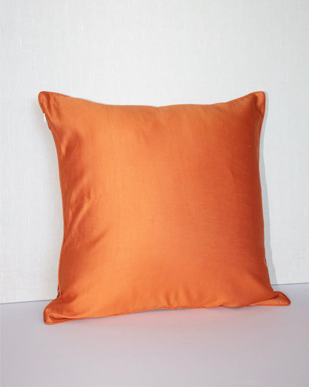 Handwoven 12x20 pillow cover made from luxurious Indian silk brocade, showcasing intricate gold, orange, and pink floral and geometric patterns. A stunning accent piece for any elegant decor.