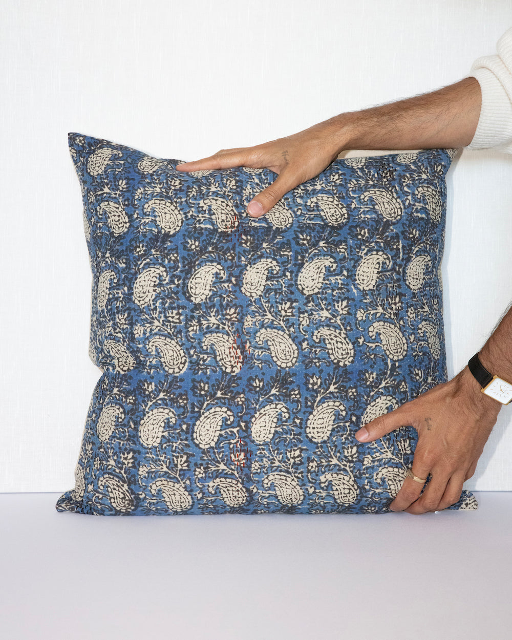 Hands holding Vintage Kantha Cushion Cover