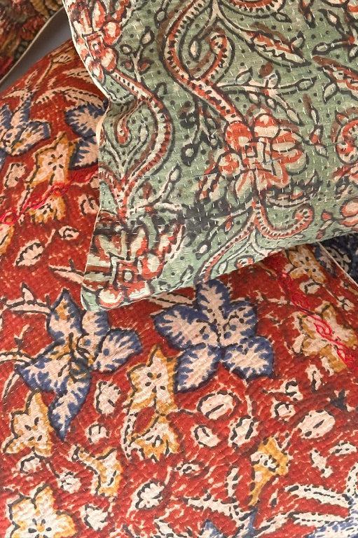 Garent Vintage Kantha Cushion Cover with traditional Bagru block print in rusty red tones, showcasing intricate hand-stitched patterns, displayed on a white background.