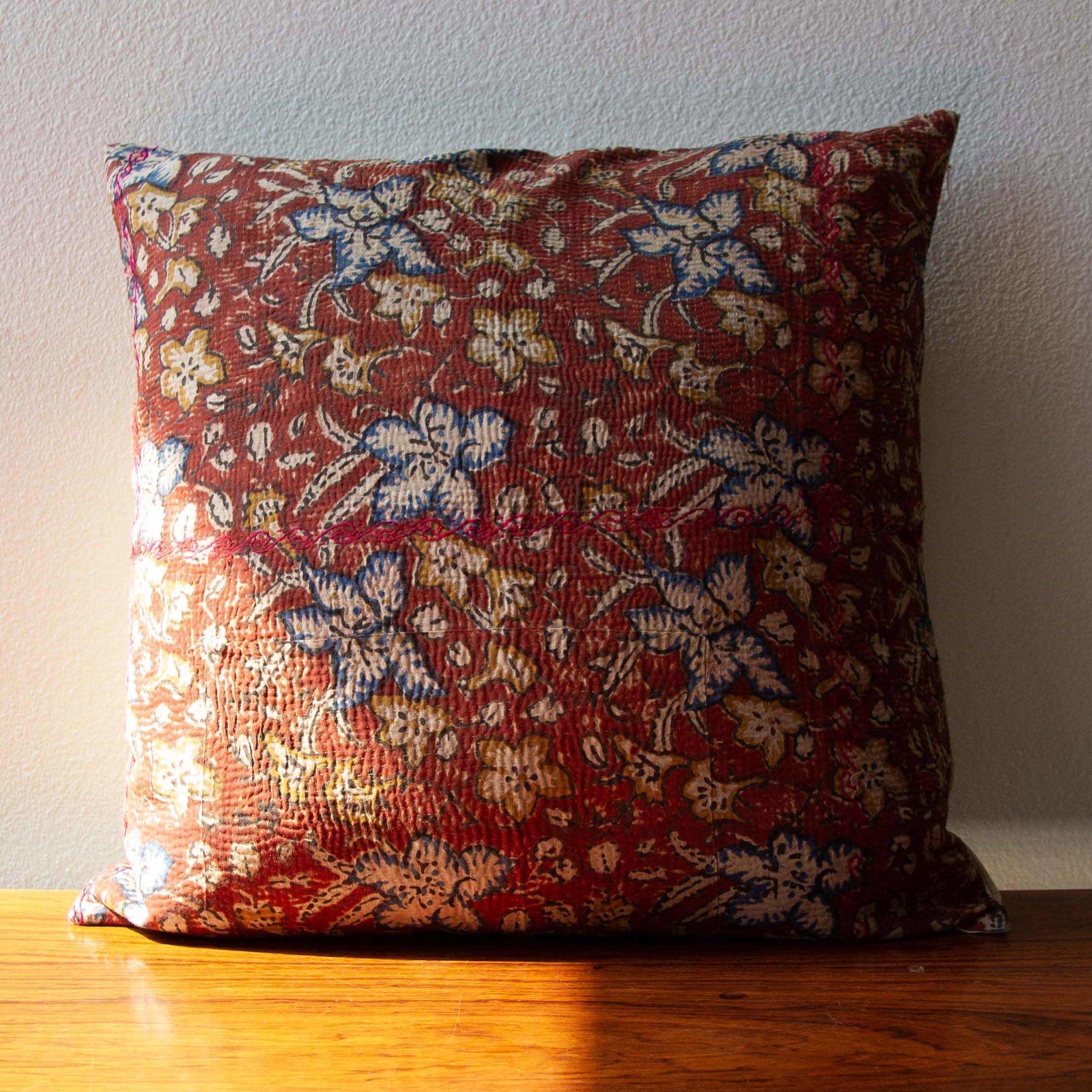 Garent Vintage Kantha Cushion Cover with traditional Bagru block print in rusty red tones, showcasing intricate hand-stitched patterns, displayed on a white background.
