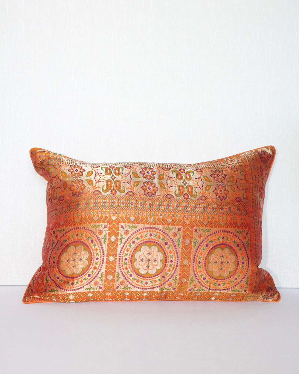 Handwoven 12x20 pillow cover made from luxurious Indian silk brocade, showcasing intricate gold, orange, and pink floral and geometric patterns. A stunning accent piece for any elegant decor.