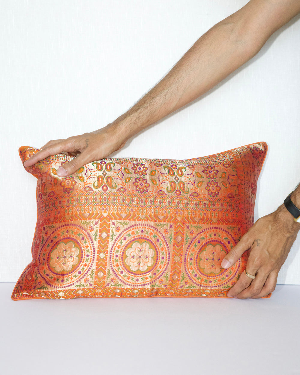 Handwoven 12x20 pillow cover made from luxurious Indian silk brocade, showcasing intricate gold, orange, and pink floral and geometric patterns. A stunning accent piece for any elegant decor.