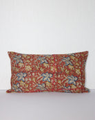 Handcrafted vintage Kantha pillow featuring a rust floral block print design, adding bohemian and rustic charm to any room. The rectangular cushion is made from repurposed fabrics, reflecting traditional Indian craftsmanship