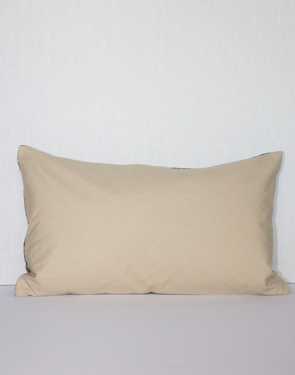 Handcrafted vintage Kantha pillow featuring a green and rust floral block print design, adding bohemian and rustic charm to any room. The rectangular cushion is made from repurposed fabrics, reflecting traditional Indian craftsmanship