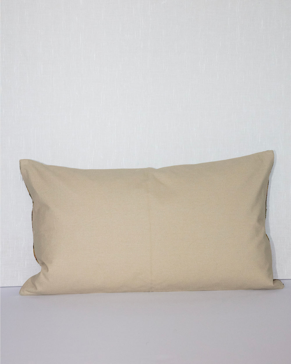 Handcrafted vintage Kantha pillow featuring a ochre and rust floral block print design, adding bohemian and rustic charm to any room. The rectangular cushion is made from repurposed fabrics, reflecting traditional Indian craftsmanship