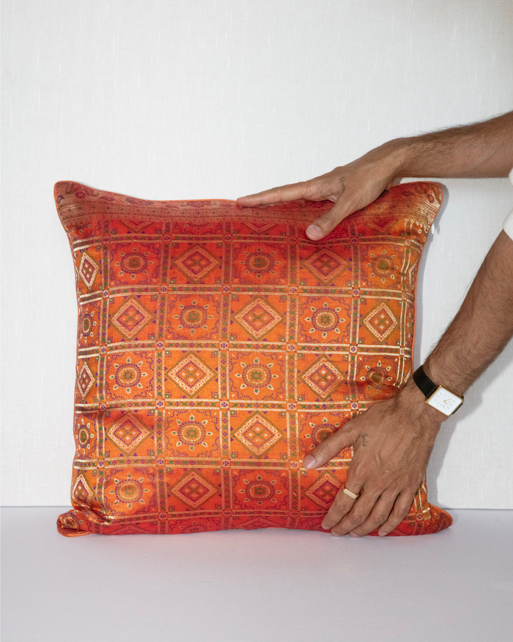 Handwoven 12x20 pillow cover made from luxurious Indian silk brocade, showcasing intricate gold, orange, and pink floral and geometric patterns. A stunning accent piece for any elegant decor.