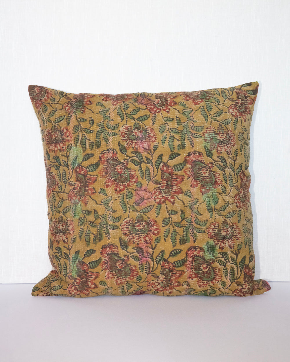 Daffodil Vintage Kantha Cushion Cover with traditional Bagru block print in earthy yellow tones, showcasing intricate hand-stitched patterns, displayed on a white background.