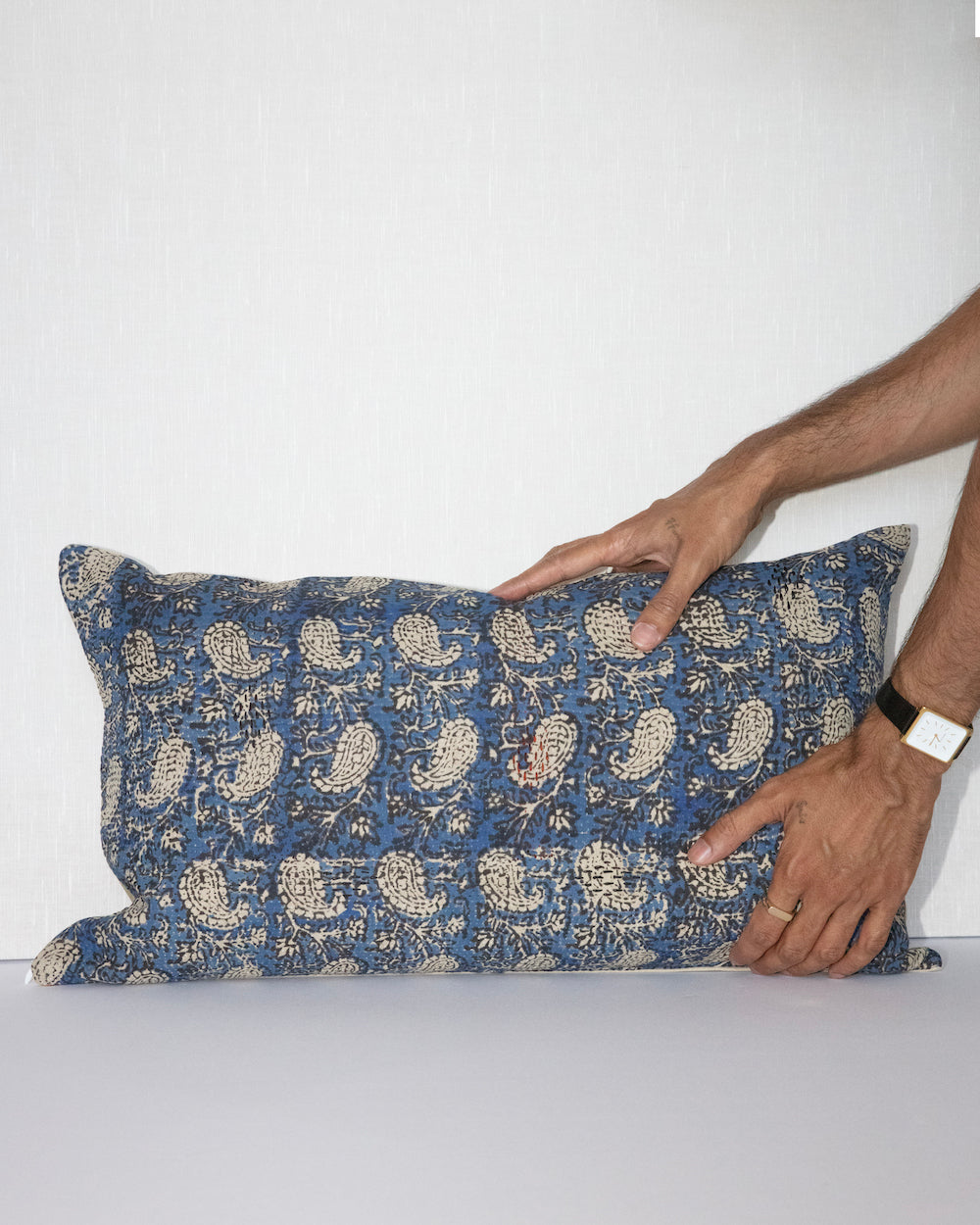 Handcrafted vintage Kantha pillow featuring a indigo paisley block print design, adding bohemian and rustic charm to any room. The rectangular cushion is made from repurposed fabrics, reflecting traditional Indian craftsmanship