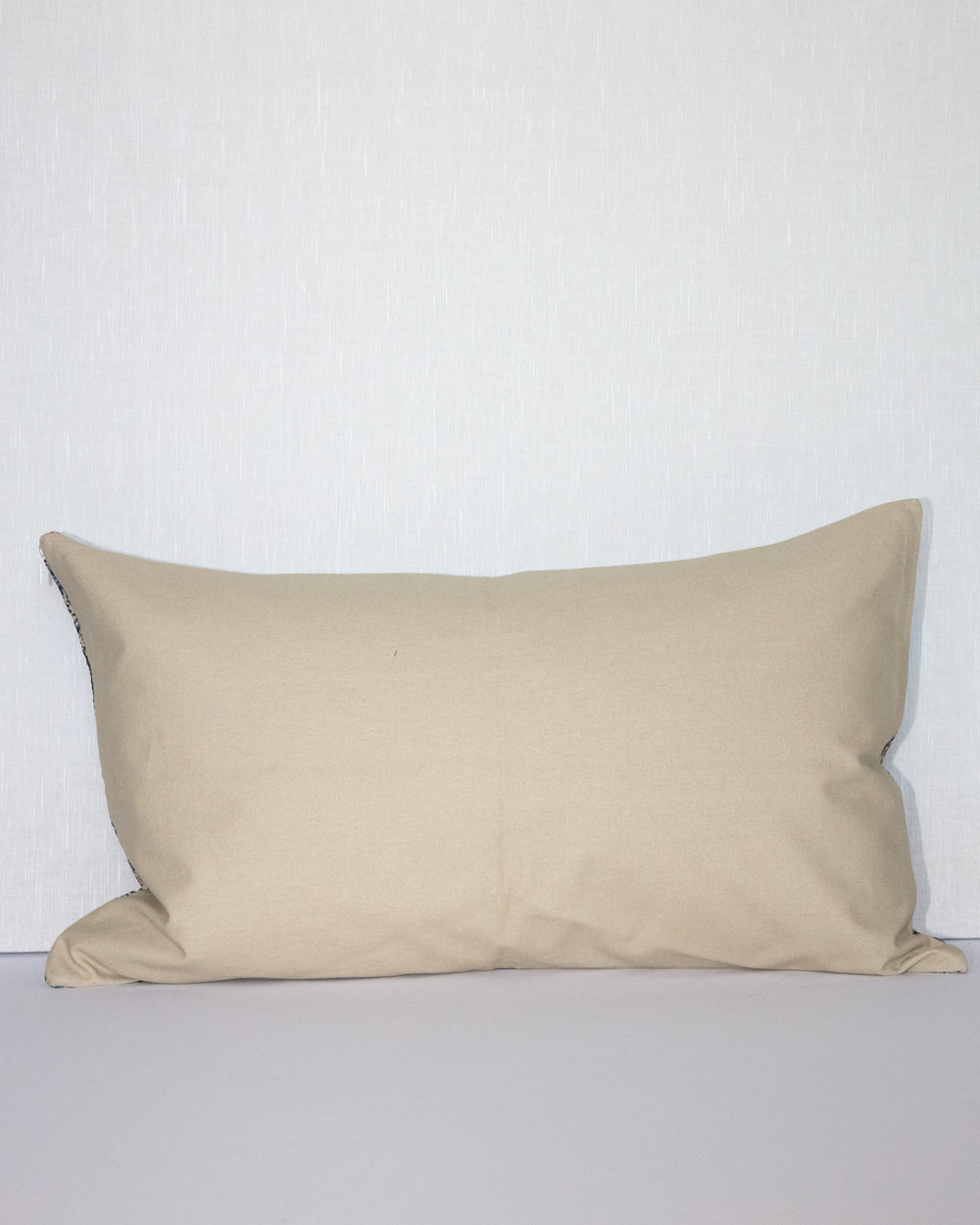 Handcrafted vintage Kantha pillow featuring a indigo paisley block print design, adding bohemian and rustic charm to any room. The rectangular cushion is made from repurposed fabrics, reflecting traditional Indian craftsmanship